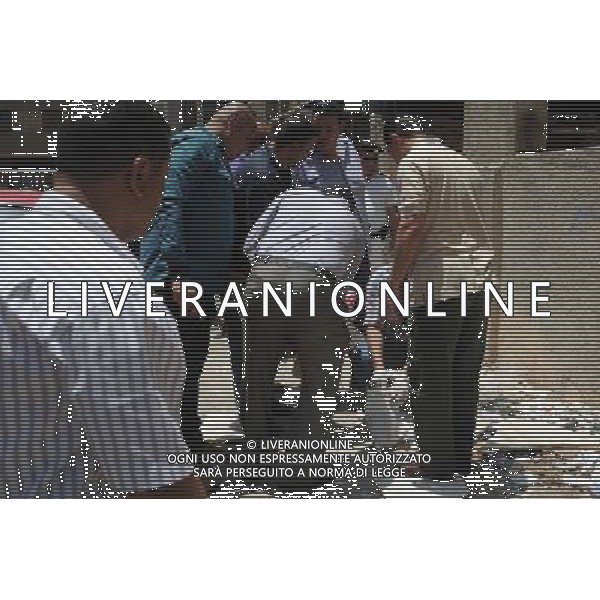 (140527) -- CAIRO, May 27, 2014 () -- Egyptian policemen inspect the explosion site on the second day of Egypt\'s presidential election in Cairo, Egypt, on May 27, 2014. One person was injured and several cars were burnt Tuesday when a primitive explosive device went off nearby a church in Cairo, official news agency MENA reported. (/Ahmed Omar) ©PHOTOSHOT/AGENZIA ALDO LIVERANI SAS - ITALY ONLY - EDITORIAL USE ONLY
