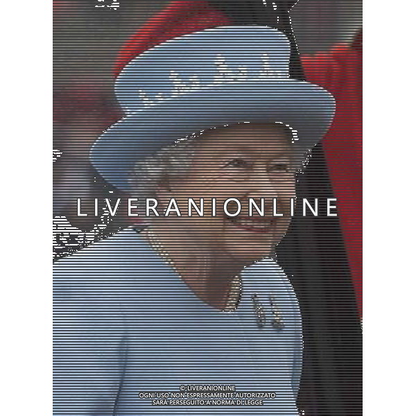 The Queen arrives on horse guards to present the Household Cavalry with their anew standard ceremony that takes place once every decade. The Household Cavalry consists of the two senior regiments in the British Army; The Life Guards and The Blues and Royals. These two regiments form the SovereignÇƒÙs personal mounted body guard while also providing an operational Armoured Cavalry Regiment, equipped with CVR(T) vehicles. This parade sees the entire regiment, both mounted on horses and in armoured vehicles being inspected by Her Majesty on Horse Guards Parade. The Household Cavalry Regiment has recently returned from its last tour to Afghanistan having had six deployments since 2004. The Standards themselves have historically acted as a rallying point during battle and now carry all of the Battle Honours of both The Life Guards and The Blues and Royals. They carry huge significance as they represent four hundred years of history of service to the monarch and to the country. The Parade will begin with the Armoured Regiment and the Mounted Regiment forming up on Horse Guards Parade, when the outgoing standards are trooped and removed from the parade. ©photoshot/Agenzia Aldo Liverani sas - ITALY ONLY - REALI INGLESI: La Regina Elisabetta II d\'inghilterra e il principe Harry, durante la cerimonia per la parata delle guardie a cavallo