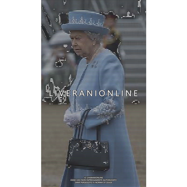 The Queen arrives on horse guards to present the Household Cavalry with their anew standard ceremony that takes place once every decade. The Household Cavalry consists of the two senior regiments in the British Army; The Life Guards and The Blues and Royals. These two regiments form the SovereignÇƒÙs personal mounted body guard while also providing an operational Armoured Cavalry Regiment, equipped with CVR(T) vehicles. This parade sees the entire regiment, both mounted on horses and in armoured vehicles being inspected by Her Majesty on Horse Guards Parade. The Household Cavalry Regiment has recently returned from its last tour to Afghanistan having had six deployments since 2004. The Standards themselves have historically acted as a rallying point during battle and now carry all of the Battle Honours of both The Life Guards and The Blues and Royals. They carry huge significance as they represent four hundred years of history of service to the monarch and to the country. The Parade will begin with the Armoured Regiment and the Mounted Regiment forming up on Horse Guards Parade, when the outgoing standards are trooped and removed from the parade. ©photoshot/Agenzia Aldo Liverani sas - ITALY ONLY - REALI INGLESI: La Regina Elisabetta II d\'inghilterra e il principe Harry, durante la cerimonia per la parata delle guardie a cavallo