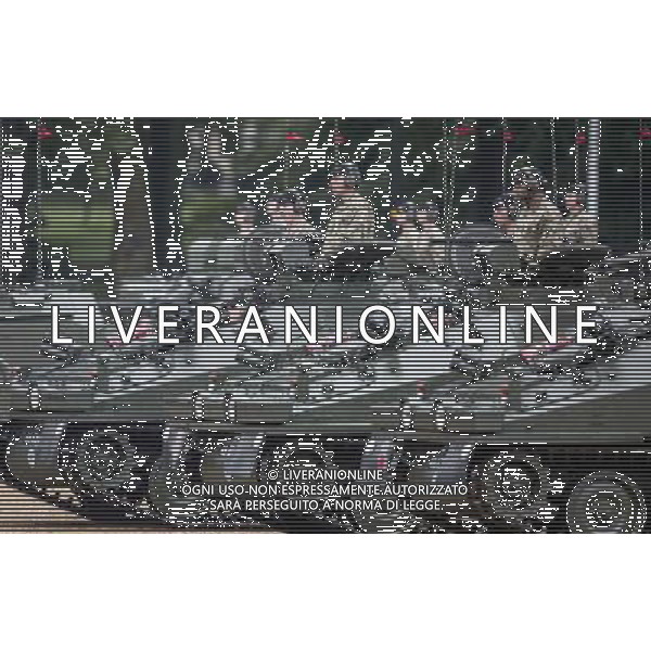 Armoured vehicles of The House hold cavalry parade in from of the Queen following the presentation of their new standards. A ceremony that takes place once every decade. The Household Cavalry consists of the two senior regiments in the British Army; The Life Guards and The Blues and Royals. These two regiments form the SovereignÇƒÙs personal mounted body guard while also providing an operational Armoured Cavalry Regiment, equipped with CVR(T) vehicles. This parade sees the entire regiment, both mounted on horses and in armoured vehicles being inspected by Her Majesty on Horse Guards Parade. The Household Cavalry Regiment has recently returned from its last tour to Afghanistan having had six deployments since 2004. The Standards themselves have historically acted as a rallying point during battle and now carry all of the Battle Honours of both The Life Guards and The Blues and Royals. They carry huge significance as they represent four hundred years of history of service to the monarch and to the country. The Parade will begin with the Armoured Regiment and the Mounted Regiment forming up on Horse Guards Parade, when the outgoing standards are trooped and removed from the parade. ©photoshot/Agenzia Aldo Liverani sas - ITALY ONLY - REALI INGLESI: La Regina Elisabetta II d\'inghilterra e il principe Harry, durante la cerimonia per la parata delle guardie a cavallo