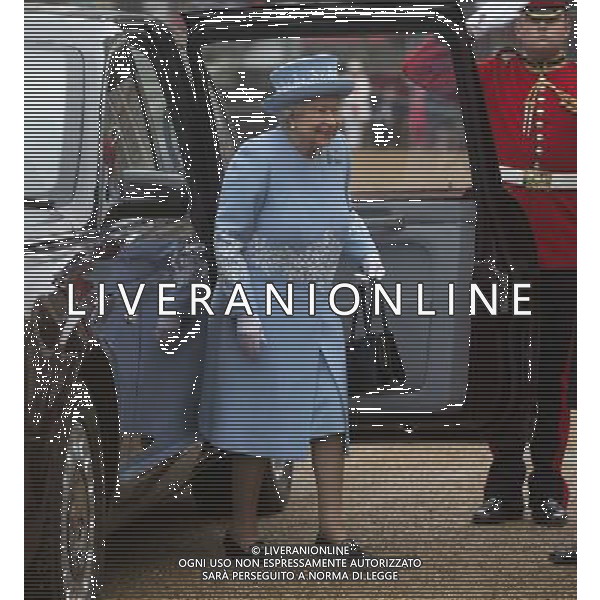 The Queen arrives on horse guards to present the Household Cavalry with their anew standard ceremony that takes place once every decade. The Household Cavalry consists of the two senior regiments in the British Army; The Life Guards and The Blues and Royals. These two regiments form the SovereignÇƒÙs personal mounted body guard while also providing an operational Armoured Cavalry Regiment, equipped with CVR(T) vehicles. This parade sees the entire regiment, both mounted on horses and in armoured vehicles being inspected by Her Majesty on Horse Guards Parade. The Household Cavalry Regiment has recently returned from its last tour to Afghanistan having had six deployments since 2004. The Standards themselves have historically acted as a rallying point during battle and now carry all of the Battle Honours of both The Life Guards and The Blues and Royals. They carry huge significance as they represent four hundred years of history of service to the monarch and to the country. The Parade will begin with the Armoured Regiment and the Mounted Regiment forming up on Horse Guards Parade, when the outgoing standards are trooped and removed from the parade. ©photoshot/Agenzia Aldo Liverani sas - ITALY ONLY - REALI INGLESI: La Regina Elisabetta II d\'inghilterra e il principe Harry, durante la cerimonia per la parata delle guardie a cavallo