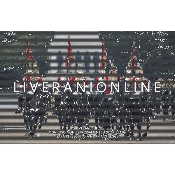 The Standards of the household cavalry are paraded on horse guards parade. The Queen presents the Household Cavalry with new standards once every decade. The Household Cavalry consists of the two senior regiments in the British Army; The Life Guards and The Blues and Royals. These two regiments form the SovereignÇƒÙs personal mounted body guard while also providing an operational Armoured Cavalry Regiment, equipped with CVR(T) vehicles. This parade sees the entire regiment, both mounted on horses and in armoured vehicles being inspected by Her Majesty on Horse Guards Parade. The Household Cavalry Regiment has recently returned from its last tour to Afghanistan having had six deployments since 2004. The Standards themselves have historically acted as a rallying point during battle and now carry all of the Battle Honours of both The Life Guards and The Blues and Royals. They carry huge significance as they represent four hundred years of history of service to the monarch and to the country. The Parade will begin with the Armoured Regiment and the Mounted Regiment forming up on Horse Guards Parade, when the outgoing standards are trooped and removed from the parade. ©photoshot/Agenzia Aldo Liverani sas - ITALY ONLY - REALI INGLESI: La Regina Elisabetta II d\'inghilterra e il principe Harry, durante la cerimonia per la parata delle guardie a cavallo