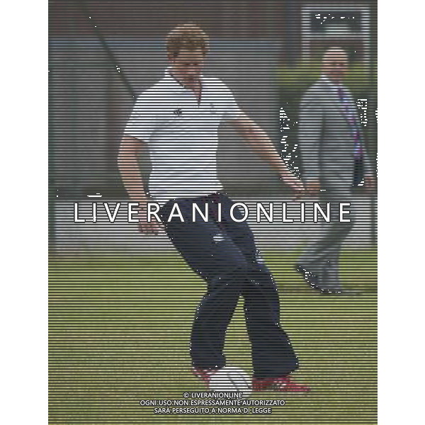 PRINCE HARRY PLAYS FOOTBALL WITH YOUNG CHILDREN AT INSPIRE SUFFOLK A YOUTH CHARITY IN IPSWICH SUFFOLK ©PHOTOSHOT/Agenzia Aldo Liverani sas - ITALY ONLY - EDITORIAL USE ONLY - REALI INGLESI: IL PRINCIPE HARRY D\'INGHILTERRA GIOCA RUGBY a Ipswich SUFFOLK INSPIRE