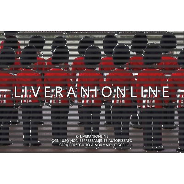 A Guard of Honour lines up in formation outside Buckingham Palace on June 4, 2014 in London, England. Queen Elizabeth II is to unveil government\'s legislative programme in a speech delivered to Members of Parliament and Peers in The House of Lords during the annual state opening of the British parliament. AG ALDO LIVERANI SAS ONLY ITALY