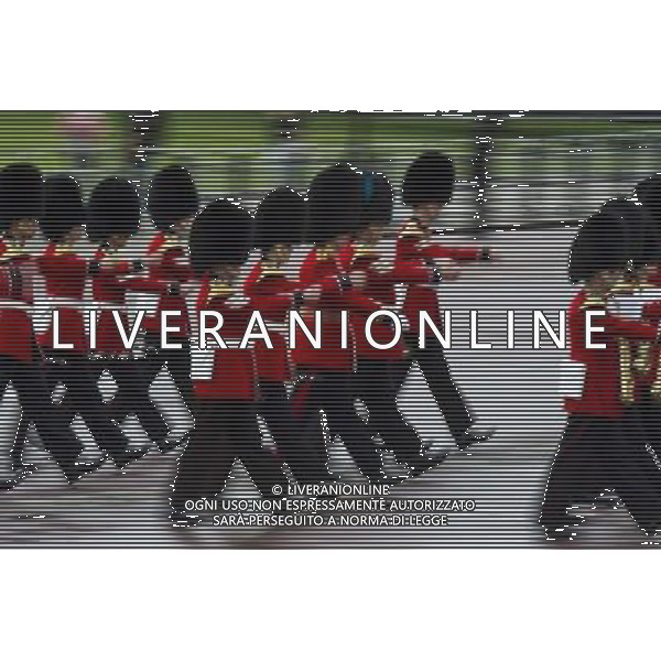A Guard of Honour marches past Buckingham Palace and down the Mall on June 4, 2014 in London, England. Queen Elizabeth II is to unveil government\'s legislative programme in a speech delivered to Members of Parliament and Peers in The House of Lords during the annual state opening of the British parliament. AG ALDO LIVERANI SAS ONLY ITALY