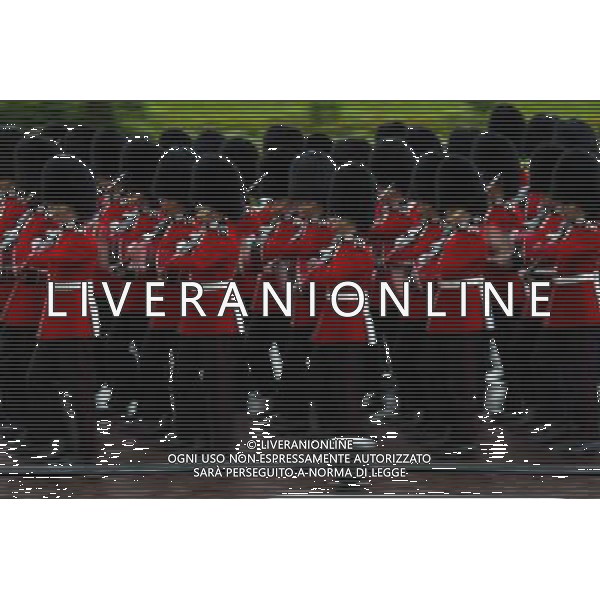 A Guard of Honour marches past Buckingham Palace and down the Mall on June 4, 2014 in London, England. Queen Elizabeth II is to unveil government\'s legislative programme in a speech delivered to Members of Parliament and Peers in The House of Lords during the annual state opening of the British parliament. AG ALDO LIVERANI SAS ONLY ITALY