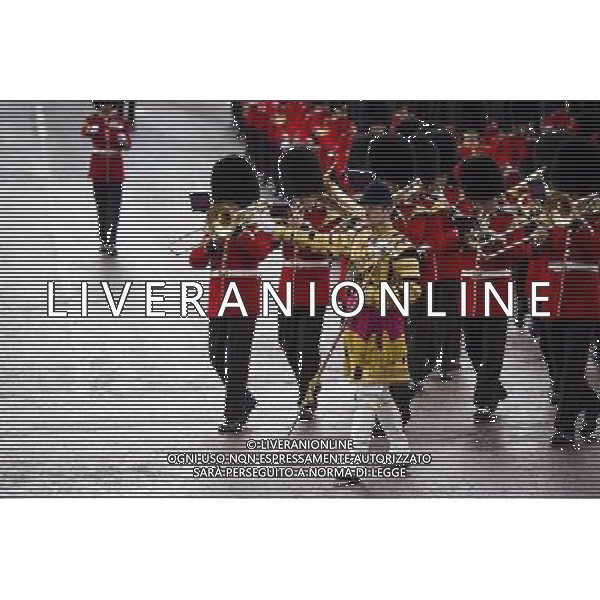A Guard of Honour marches past Buckingham Palace and down the Mall on June 4, 2014 in London, England. Queen Elizabeth II is to unveil government\'s legislative programme in a speech delivered to Members of Parliament and Peers in The House of Lords during the annual state opening of the British parliament. AG ALDO LIVERANI SAS ONLY ITALY