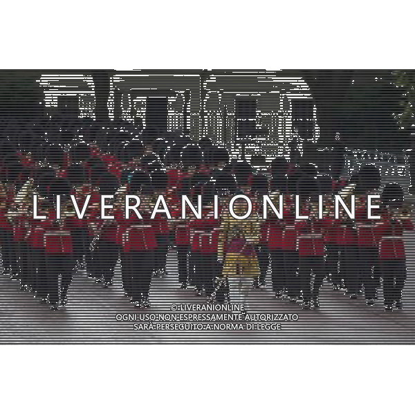 A Guard of Honour marches past Buckingham Palace and down the Mall on June 4, 2014 in London, England. Queen Elizabeth II is to unveil government\'s legislative programme in a speech delivered to Members of Parliament and Peers in The House of Lords during the annual state opening of the British parliament. AG ALDO LIVERANI SAS ONLY ITALY