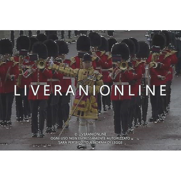 A Guard of Honour marches past Buckingham Palace and down the Mall on June 4, 2014 in London, England. Queen Elizabeth II is to unveil government\'s legislative programme in a speech delivered to Members of Parliament and Peers in The House of Lords during the annual state opening of the British parliament. AG ALDO LIVERANI SAS ONLY ITALY