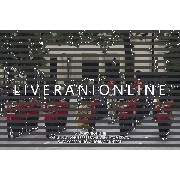 A Guard of Honour marches past Buckingham Palace and down the Mall on June 4, 2014 in London, England. Queen Elizabeth II is to unveil government\'s legislative programme in a speech delivered to Members of Parliament and Peers in The House of Lords during the annual state opening of the British parliament. AG ALDO LIVERANI SAS ONLY ITALY