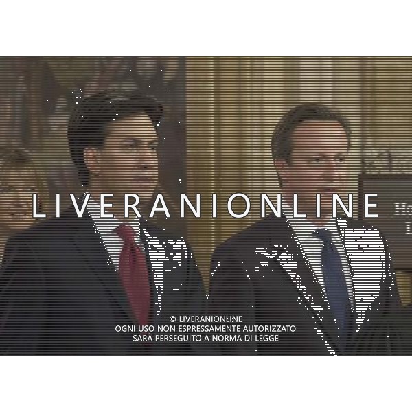  Date: 04/06/14 Pictured: Prime Minster David Cameron and Labour party leader Ed Miliband Caption: Mp\'s walk through the Central Lobby in the houses of Parliament in London today for the State Opening of Parliament which takes place on the first day of a new parliamentary session. The Queen makes a Speech setting out the Government\'s agenda for the year ahead. AG ALDO LIVERANI SAS ONLY ITALY