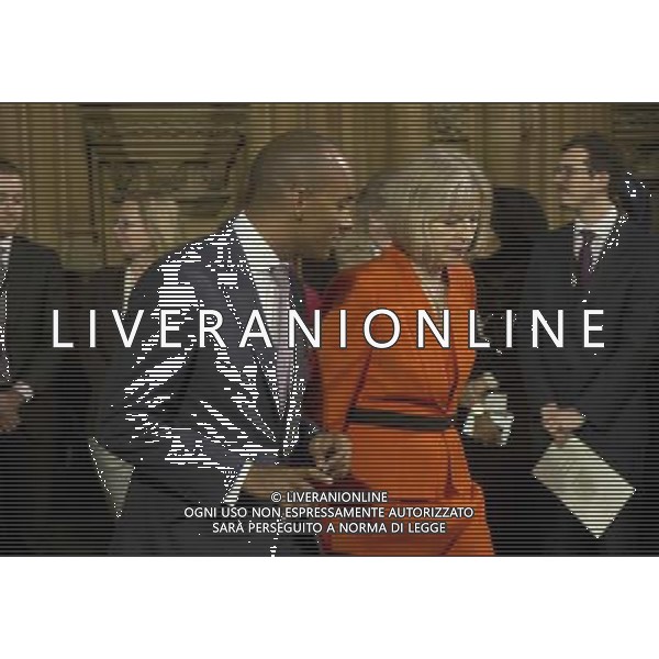  Date: 04/06/14 Pictured: Theresa May and Chuka Umunna Caption: Mp\'s walk through the Central Lobby in the houses of Parliament in London today for the State Opening of Parliament which takes place on the first day of a new parliamentary session. The Queen makes a Speech setting out the Government\'s agenda for the year ahead. AG ALDO LIVERANI SAS ONLY ITALY