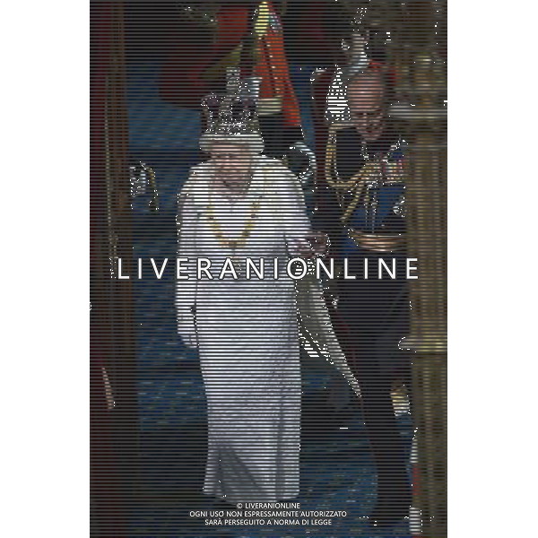 Britain\'s Queen Elizabeth II (L) with Prince Philip, Duke of Edinburgh (R) arrive in the House of Lords to deliver the Queen\'s Speech during the State Opening of Parliament at the Palace of Westminster in London on June 4, 2014. The State Opening of Parliament marks the formal start of the parliamentary year and the Queen\'s Speech sets out the government\'s agenda for the coming session. AG ALDO LIVERANI SAS ONLY ITALY