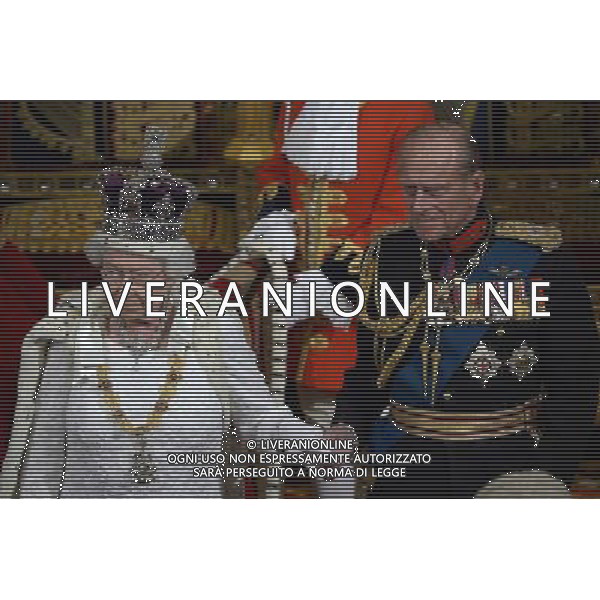 Britain\'s Queen Elizabeth II (L) and Prince Philip, Duke of Edinburgh (R) leave the House of Lords after delivering the Queen\'s Speech during the State Opening of Parliament at the Palace of Westminster in London on June 4, 2014. The State Opening of Parliament marks the formal start of the parliamentary year and the Queen\'s Speech sets out the government\'s agenda for the coming session. AG ALDO LIVERANI SAS ONLY ITALY