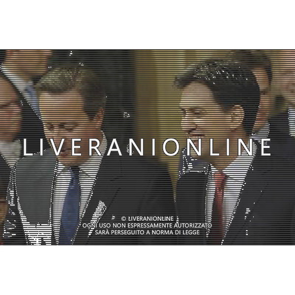 British Prime Minister David Cameron (L) and Leader of the Labour Party and Opposition Ed Miliband (R) walk through the Members Lobby at the State Opening of Parliament, Palace of Westminster, London, UK. 04/06/2014. AG ALDO LIVERANI SAS ONLY ITALY