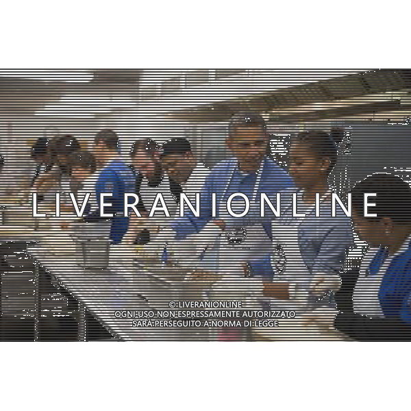 President Barack Obama and his daughter Sasha assemble burritos during a Martin Luther King, Jr. Day of Service event at DC Central Kitchen in Washington, D.C., Jan. 20, 2014. ©photoshot/Agenzia Aldo Liverani sas - ITALY ONLY - Il Presidente americano Barack Obama