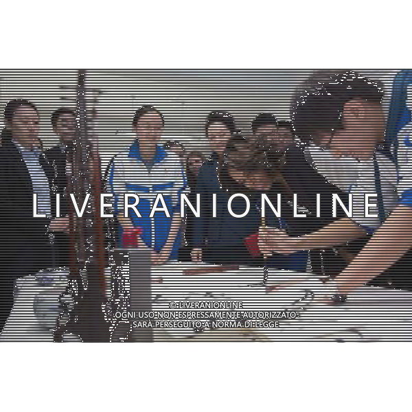 First Lady Michelle Obama and First Lady Peng Liyuan of China watch a calligraphy demonstration during a tour of No. 2 High School in Beijing, China, March 21, 2014. ©PHOTOSHOT/Agenzia Aldo Liverani sas - ITALY ONLY - EDITORIAL USE ONLY - Il Presidente americano Barack Obama