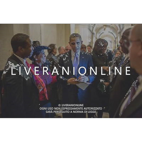 President Barack Obama signs a copy of his speech for Rep. Frederica Wilson, D-Fla., in a hallway outside the House Chamber as he and First Lady Michelle Obama depart after the State of the Union address at the U.S. Capitol in Washington, D.C., Jan. 28, 2014. ©PHOTOSHOT/Agenzia Aldo Liverani sas - ITALY ONLY - EDITORIAL USE ONLY - Il Presidente americano Barack Obama