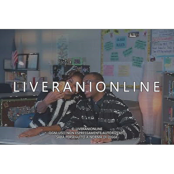 First Lady Michelle Obama takes a selfie with Baltimore student Lawrence Lawson\'s phone following a FAFSA (Free Application for Federal Student Aid) workshop at T.C. Williams High School in Alexandria, Va., Feb. 5, 2014. ©PHOTOSHOT/Agenzia Aldo Liverani sas - ITALY ONLY - EDITORIAL USE ONLY - Il Presidente americano Barack Obama