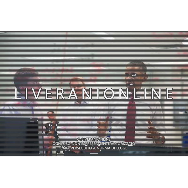 President Barack Obama talks with an employee during a tour of Vacon USA, with Vacon Vice President Dan Isaksson, center, in Durham, North Carolina, Jan. 15, 2014. ©PHOTOSHOT/Agenzia Aldo Liverani sas - ITALY ONLY - EDITORIAL USE ONLY - Il Presidente americano Barack Obama