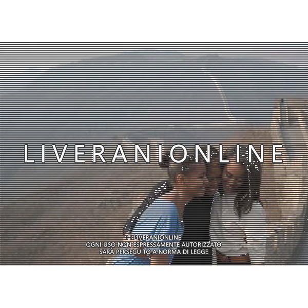 First Lady Michelle Obama hugs daughters Sasha, left, and Malia as they visit the Great Wall of China in Mutianyu, China, March 23, 2014. ©PHOTOSHOT/Agenzia Aldo Liverani sas - ITALY ONLY - EDITORIAL USE ONLY - Il Presidente americano Barack Obama