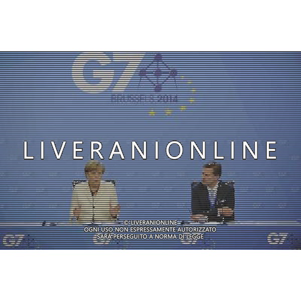(140605) -- BRUSSELS, June 5, 2014 () -- Germany\'s Chancellor Angela Merkel (L) speaks at a press briefing after the G7 Summit, at the EU Council headquarters in Brussels of Belgium, June 5, 2014.(/Ye Pingfan) ©PHOTOSHOT/Agenzia Aldo Liverani sas - ITALY ONLY - EDITORIAL USE ONLY - Vertice del G7 a Bruxelles, in Belgio, 5 Giugno 2014