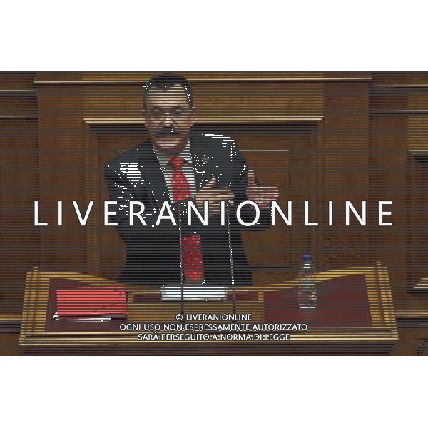 (140604) -- ATHENS, Jun. 04, 2014 () -- Christos Pappas, lawmaker of the far-right political party Golden Dawn, speaks to parliament members in Athens, Wednesday, June 4, 2014. Nikos Michaloliakos, leader of Golden Dawn, and Christos Pappas and Yannis Lagos, two deputies of the party, were transferred from prison to parliament to speak during a debate on lifting their immunity on new charges concerning weapon carrying. (/Marios Lolos)(bxq) ©photoshot/Agenzia Aldo Liverani sas - ITALY ONLY - EDITORIAL USE ONLY ©PHOTOSHOT/Agenzia Aldo Liverani Sas - ITALY ONLY - EDITORIAL USE ONLY