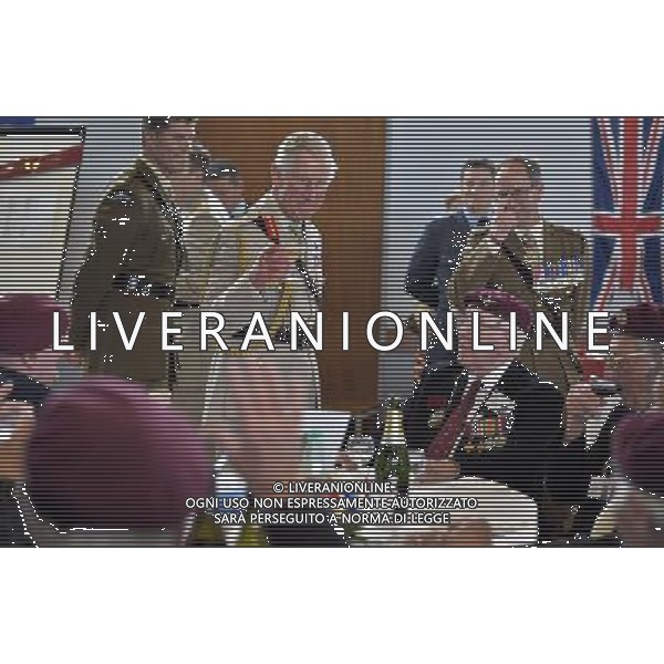 Pic Bruce Adams / Copy Rota - 05/06/14 D-Day 70th Anniversary commemorations. - **ROYAL ROTA** - HRH Prince Charles and the Duchess Of Cornwall attend a lunch with D-day veterans at a community centre in Ranville, Normandy, France. - REALI INGLESI - il Principe Carlo d\'inghilterra con la moglie Camilla duchessa di Cornovaglia partecipare ad un pranzo con i veterani del 70mo Anniversario del D-day in un centro sociale in Ranville, Normandia, Francia