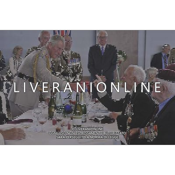  D-Day 70th Anniversary commemorations. - **ROYAL ROTA** - HRH Prince Charles and the Duchess Of Cornwall attend a lunch with D-day veterans at a community centre in Ranville, Normandy, France. Â©PHOTOSHOT/Agenzia Aldo Liverani sas - ITALY ONLY - EDITORIAL USE ONLY