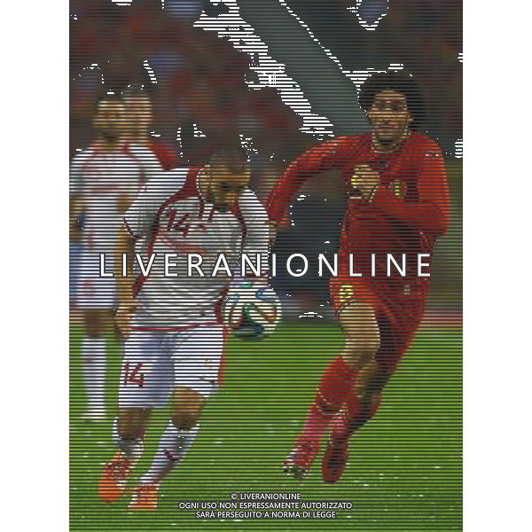 (140608) -- BRUSSELS, June 8, 2014 () -- Belgium\'s Marouane Fellaini (R) vies with Tunisia\'s Houcine Nater during a friendly soccer match in Brussels, on June 7, 2014. Belgium won 1-0. (/Gong Bing) (hy) ©PHOTOSHOT/Agenzia Aldo Liverani sas - ITALY ONLY - EDITORIAL USE ONLY - BELGIO VS TUNISIA partita di calcio amichevole a Bruxelles, 7 giugno 2014. Il Belgio ha vinto per 1-0
