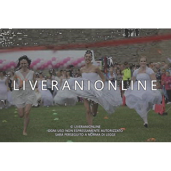 (140607) -- NARVA, June 7, 2014 () -- Women in wedding dresses compete in an annual Runaway Brides competition in Narva of Estonia, June 7, 2014. A total of 73 married and single women from Estonia and Russia dressed up as brides raced on a 50-meter grass track here on Saturday. (/Sergei Stepanov) ©PHOTOSHOT/Agenzia Aldo Liverani sas - ITALY ONLY - EDITORIAL USE ONLY - Donne in abiti da sposa competono in un concorso una corsa annuale Runaway Brides in Narva Estonia, 7 giugno 2014