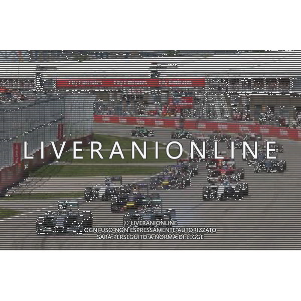 Nico Rosberg (GER) Mercedes AMG F1 W05 (Right) locks up under braking at the start of the race next to team mate Lewis Hamilton (GBR) Mercedes AMG F1 W05. 08.06.2014. Formula 1 World Championship, Rd 7, Canadian Grand Prix, Montreal, Canada, Race Day. - www.xpbimages.com, EMail: requests@xpbimages.com - copy of publication required for printed pictures. Every used picture is fee-liable. © Copyright: Moy / XPB Images AG ALDO LIVERANI SAS ONLY ITALY