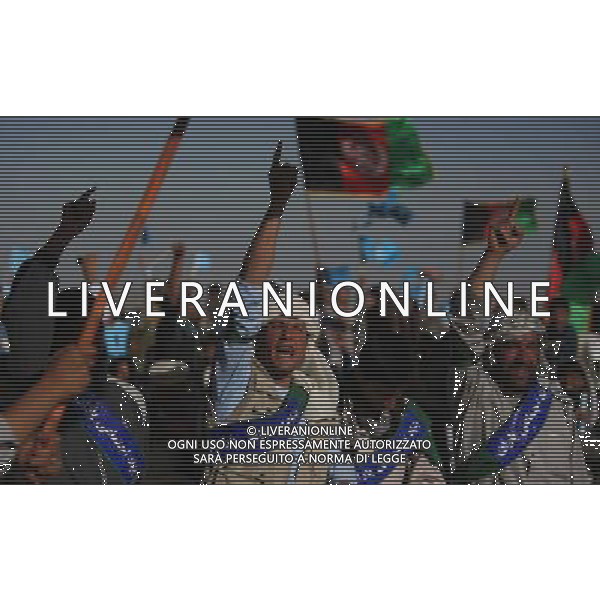 (140610) -- Kabul, June 10,2014.() -- Supporters shout slogans during an election campaign on the outskirts of Kabul, Afghanistan on June 9, 2014. (/Ahmad Massoud) ©PHOTOSHOT/Agenzia Aldo Liverani sas - ITALY ONLY - EDITORIAL USE ONLY - Campagna elettorale per le elezioni presidenziali alla periferia di Kabul, in Afghanistan il 9 giugno 2014