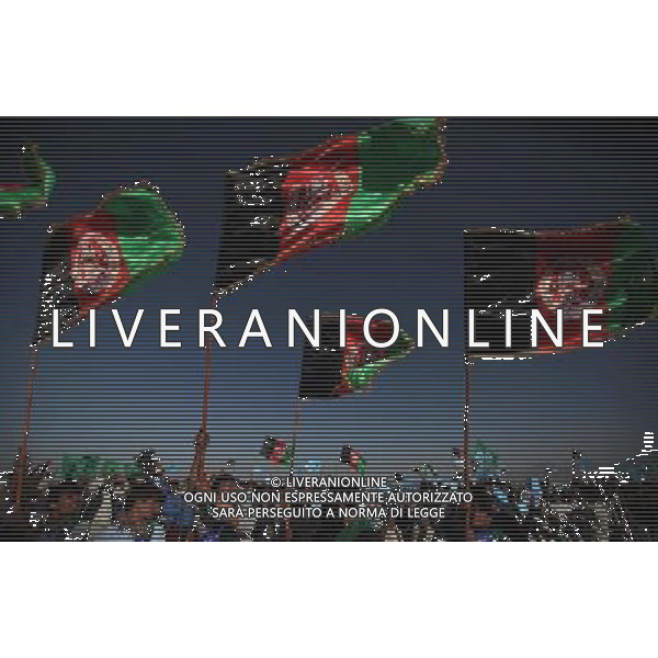 (140610) -- Kabul, June 10,2014.() -- Supporters shout slogans during an election campaign on the outskirts of Kabul, Afghanistan on June 9, 2014. (/Ahmad Massoud) ©PHOTOSHOT/Agenzia Aldo Liverani sas - ITALY ONLY - EDITORIAL USE ONLY - Campagna elettorale per le elezioni presidenziali alla periferia di Kabul, in Afghanistan il 9 giugno 2014