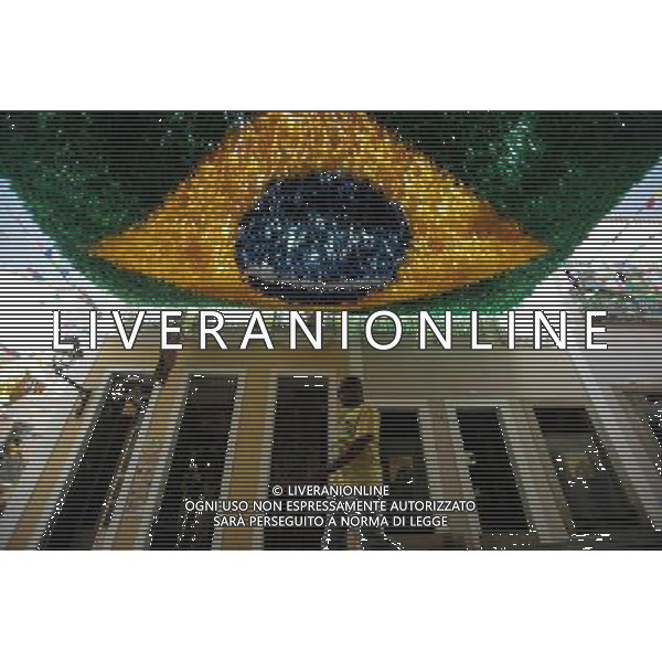(140611) -- SALVADOR, June 11, 2014 () -- A man walks under Brazilian national flag in a street in the Pelourihno neighborhood in Salvador, Brazil, on June 11, 2014. The 2014 FIFA World Cup will be held in Brazil from June 12 to July 13.(/Jhon Paz) (rh) AG ALDO LIVERANI SAS ONLY ITALY