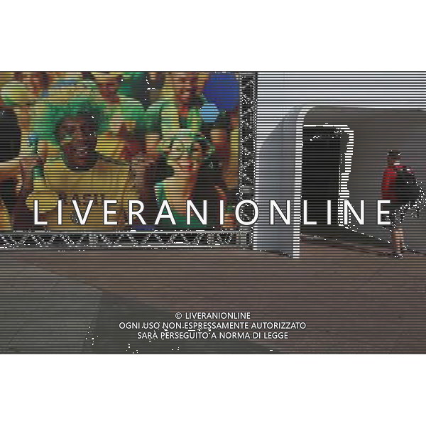 (140611) -- SAO PAULO, June 11, 2014 () -- A man passes by a poster promoting the FIFA World Cup 2014 at the Congonhas Airport in Sao Paulo, Brazil, on June 11, 2014. Sao Paulo will host the opening match of the FIFA World Cup Brazil 2014. (/Rahel Patrasso)(rh) ©PHOTOSHOT/Agenzia Aldo Liverani sas - ITALY ONLY - EDITORIAL USE ONLY - Preparativi e attesa dell\'inizio della coppa del mondo FIFA Brasile 2014