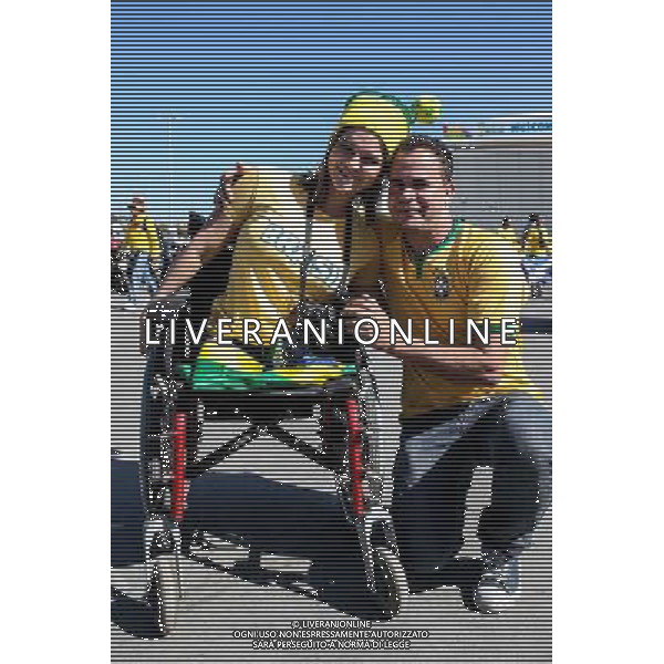 (140612) -- SAO PAULO, June 12, 2014 () -- Brasil\'s fans pose on the surroundings of the Arena de Sao Paulo Stadium, before the opening ceremony of the 2014 FIFA World Cup, in Sao Paulo, Brazil, on June 12, 2014. (/Thiago Bernardes/AGENCIA ESTADO)(rh) AG ALDO LIVERANI SAS ONLY ITALY