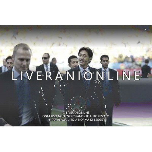(140612) -- SAO PAULO, June 12, 2014 () -- Japanese refree Nishimura Yuichi (R) enters into the field of the Arena de Sao Paulo Stadium before the opening match of 2014 FIFA World Cup in Sao Paulo, Brazil, June 12, 2014. (/Qi Heng)(rh) AG ALDO LIVERANI SAS ONLY ITALY