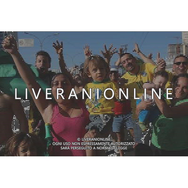 (140612) -- SAO PAULO, June 12, 2014 () -- Football fans cheer for the opening match of 2014 FIFA World Cup outside the Arena de Sao Paulo Stadium in Sao Paulo, Brazil, June 12, 2014.(/Rahel Patrasso)(pcy) AG ALDO LIVERANI SAS ONLY ITALY