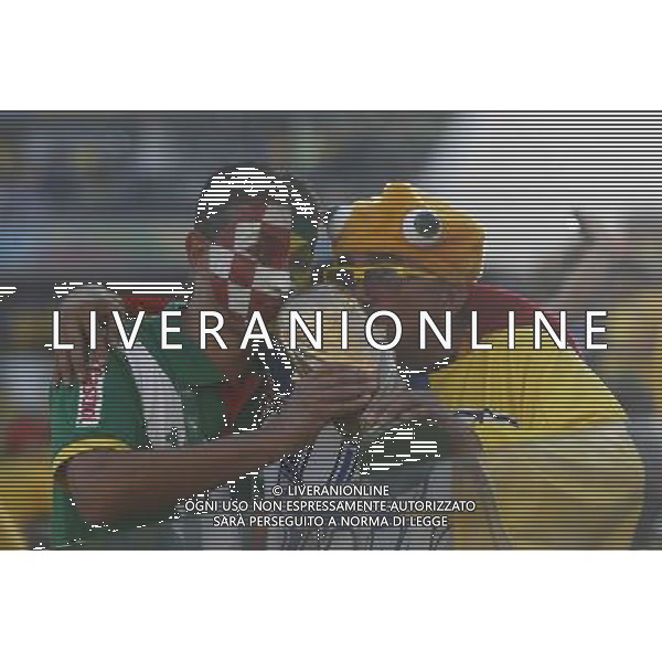 (140612) -- SAO PAULO, June 12, 2014 () -- Fans kiss a replica of the FIFA World Cup Trophy ahead of the opening match of 2014 FIFA World Cup in Arena de Sao Paulo Stadium in Sao Paulo, Brazil, June 12, 2014. (/Zhou Lei)(rh) AG ALDO LIVERANI SAS ONLY ITALY