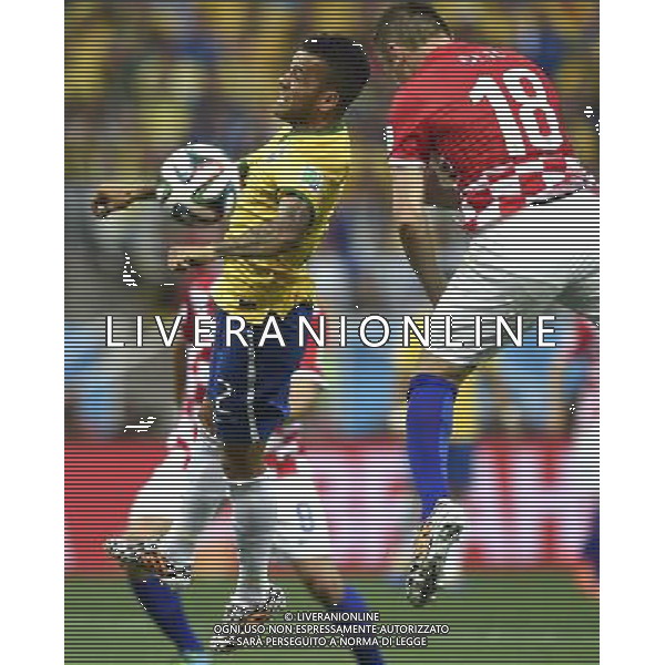 (140612) -- SAO PAULO, June 12, 2014 () -- Brazil\'s Alves Dani jumps for a head ball against Croatia\'s Olic Ivica during the opening match of 2014 FIFA World Cup in the Arena de Sao Paulo Stadium in Sao Paulo, Brazil, June 12, 2014. (/Qi Heng)(rh) AG ALDO LIVERANI SAS ONLY ITALY