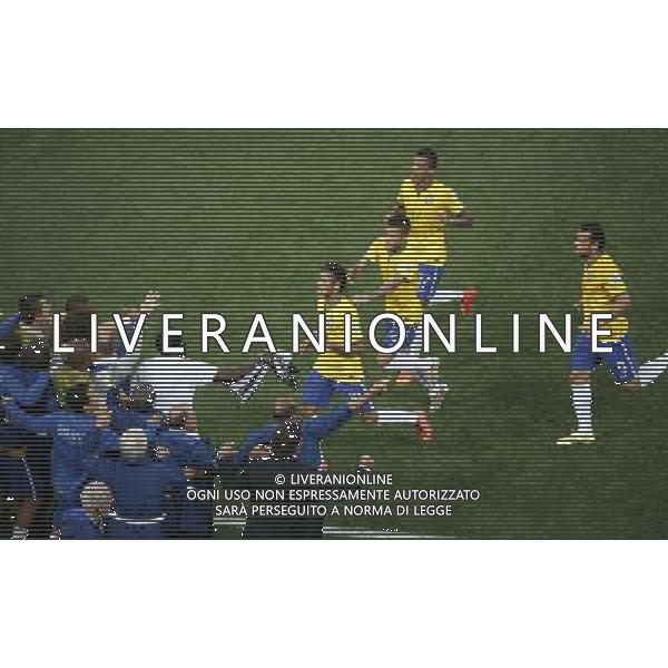 (140612) -- SAO PAULO, June 12, 2014 () -- Brazil\'s Neymar (C) runs to team members by the field for celebrateing his goal during the opening match of 2014 FIFA World Cup in the Arena de Sao Paulo Stadium in Sao Paulo, Brazil, June 12, 2014.(/Liao Yujie)(pcy) AG ALDO LIVERANI SAS ONLY ITALY