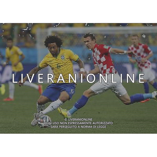 (140612) -- SAO PAULO, June 12, 2014 () -- Brazil\'s Marcelo vies with Croatia\'s Ivan Perisic during the opening match of 2014 FIFA World Cup in the Arena de Sao Paulo Stadium in Sao Paulo, Brazil, June 12, 2014. (/Zhou Lei)(rh) AG ALDO LIVERANI SAS ONLY ITALY