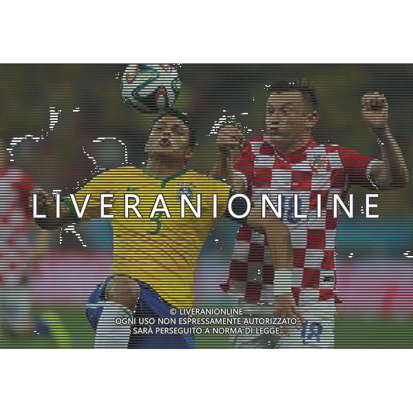 (140612) -- SAO PAULO, June 12, 2014 () -- Brazil\'s Thiago Silva (L) competes to gain control of the ball against Croatia\'s Ivica Olic during the opening match of 2014 FIFA World Cup in the Arena de Sao Paulo Stadium in Sao Paulo, Brazil, June 12, 2014.(/Xu Zijian)(pcy) AG ALDO LIVERANI SAS ONLY ITALY