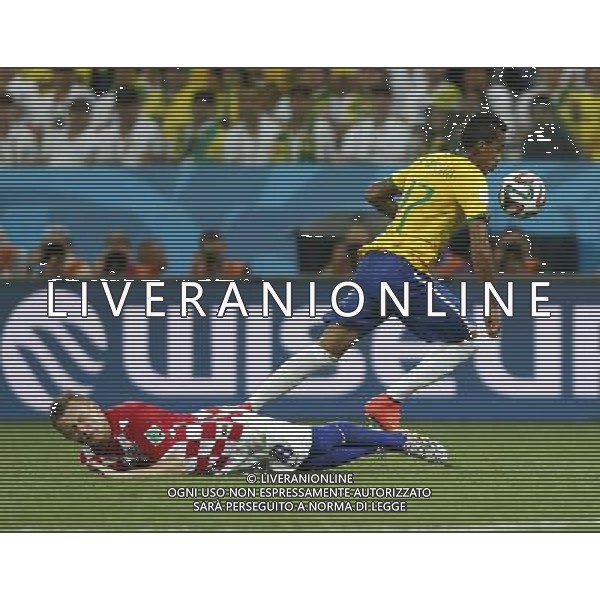 (140612) -- SAO PAULO, June 12, 2014 () -- Brazil\'s Luiz Gustavo vies with Croatia\'s Ivica Olic during the opening match of 2014 FIFA World Cup in the Arena de Sao Paulo Stadium in Sao Paulo, Brazil, June 12, 2014. Brazil won 3-1 over Croatia on Thursday. (/Wang Lili)(rh) AG ALDO LIVERANI SAS ONLY ITALY