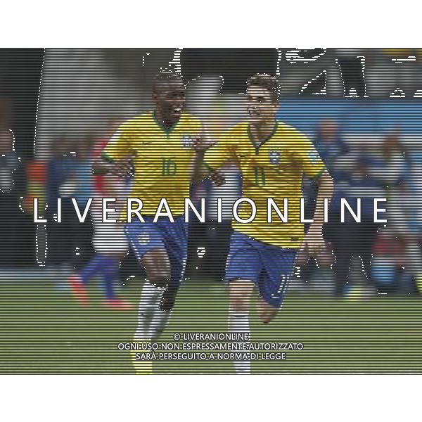 (140612) -- SAO PAULO, June 12, 2014 () -- Brazil\'s Oscar (R) celebrates after scoring the third goal of Brazil during the opening match of 2014 FIFA World Cup in the Arena de Sao Paulo Stadium in Sao Paulo, Brazil, June 12, 2014. (/Zhou Lei)(rh) AG ALDO LIVERANI SAS ONLY ITALY