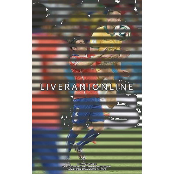 (140613) -- CUIABA, June 13, 2014 () -- Australia\'s Ivan Franjic (R) competes with Chile\'s Eugenio Mena (C) during a Group B match between Chile and Australia of 2014 FIFA World Cup in the Arena Pantanal Stadium in Cuiaba, Brazil, June 13, 2014. (/Liu Dawei)(pcy) ©photoshot/Agenzia Aldo Liverani sas - ITALY ONLY - EDITORIAL USE ONLY - Cile v Australia partita del Gruppo B Coppa del mondo FIFA World Cup nel Pantanal stadio Arena di Cuiaba, Brasile, 13 giugno 2014