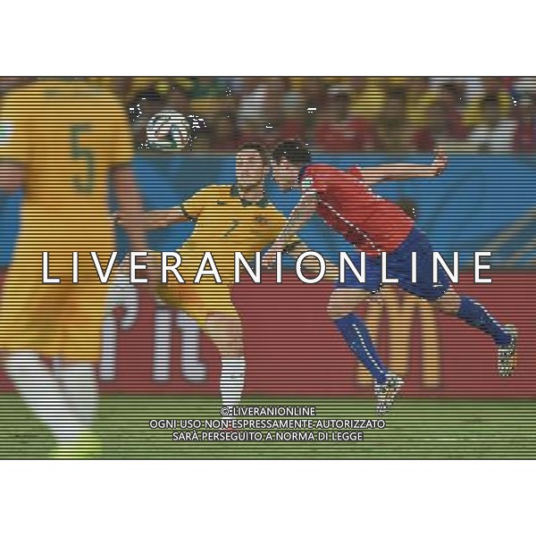 (140613) -- CUIABA, June 13, 2014 () -- Australia\'s Matthew Leckie (C) competes with Chile\'s Eugenio Mena during a Group B match between Chile and Australia of 2014 FIFA World Cup in the Arena Pantanal Stadium in Cuiaba, Brazil, June 13, 2014. (/Liu Dawei)(pcy) ©photoshot/Agenzia Aldo Liverani sas - ITALY ONLY - EDITORIAL USE ONLY - Cile v Australia partita del Gruppo B Coppa del mondo FIFA World Cup nel Pantanal stadio Arena di Cuiaba, Brasile, 13 giugno 2014