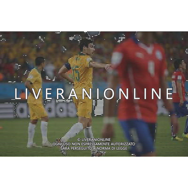 (140613) -- CUIABA, June 13, 2014 () -- Australia\'s Mile Jedinak (C) reacts during a Group B match between Chile and Australia of 2014 FIFA World Cup in the Arena Pantanal Stadium in Cuiaba, Brazil, June 13, 2014. (/Li Ming)(rh) ©photoshot/Agenzia Aldo Liverani sas - ITALY ONLY - EDITORIAL USE ONLY - Cile v Australia partita del Gruppo B Coppa del mondo FIFA World Cup nel Pantanal stadio Arena di Cuiaba, Brasile, 13 giugno 2014