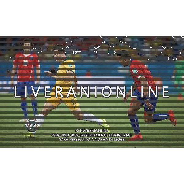 (140613) -- CUIABA, June 13, 2014 () -- Australia\'s Tommy Oar controls the ball during a Group B match between Chile and Australia of 2014 FIFA World Cup in the Arena Pantanal Stadium in Cuiaba, Brazil, June 13, 2014. (/Li Ming)(rh) ©photoshot/Agenzia Aldo Liverani sas - ITALY ONLY - EDITORIAL USE ONLY - Cile v Australia partita del Gruppo B Coppa del mondo FIFA World Cup nel Pantanal stadio Arena di Cuiaba, Brasile, 13 giugno 2014